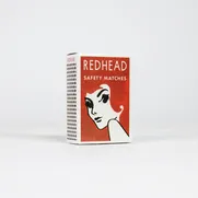 Redhead - A 150 Piece Matchbox Jigsaw Puzzle by Murtaza M. Bookwala - Thumbnail Image